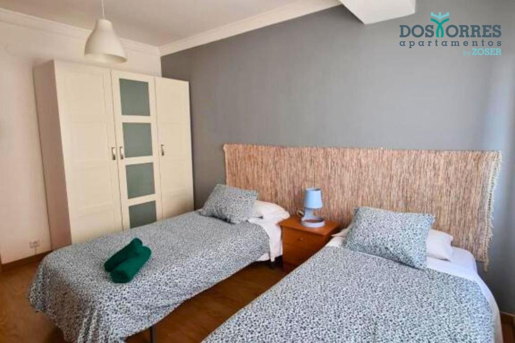 Postel nebo postele na pokoji v ubytování Dos Torres Légolas - Ideal para Empresas con Parking Gratuito