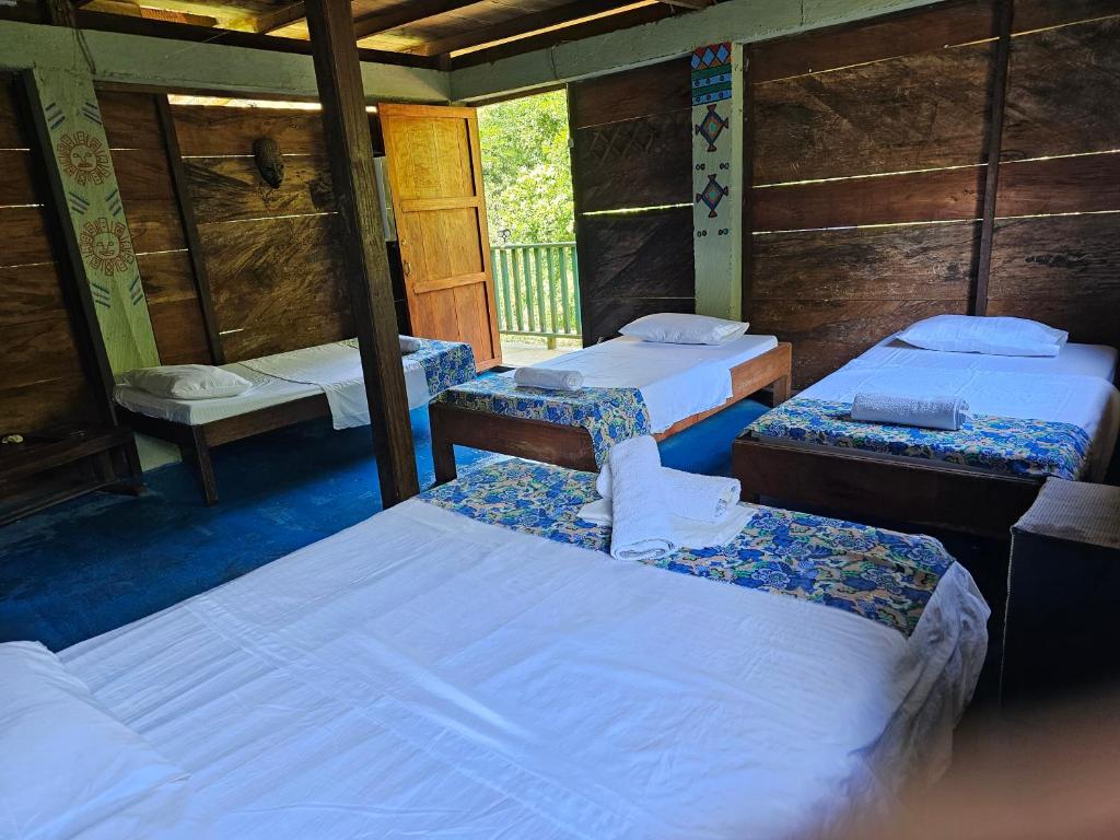 Letto o letti in una camera di Ecohotel Bahía Terco