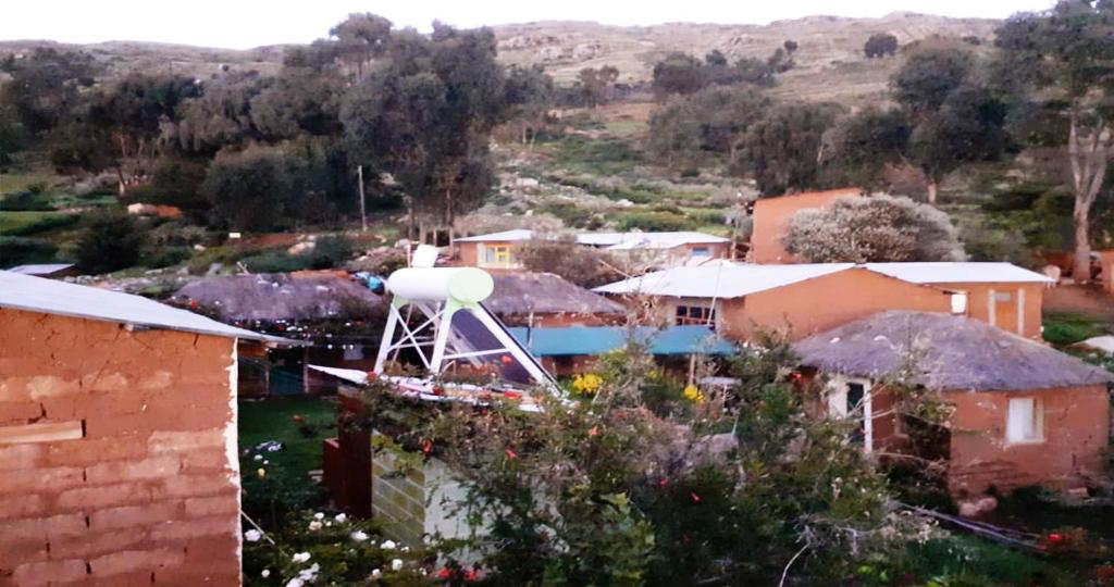 a view of a village with a water tower at Inti Raymi Lodge in Escallani