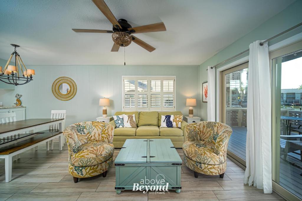 a living room with a couch and two chairs at The Cobalt Crab Oasis in Rockport