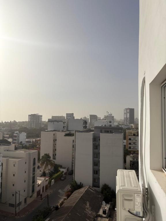 a view of a city from a building at Harajuku in Dakar