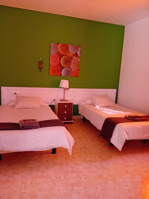 Postel nebo postele na pokoji v ubytování Villas Reina
