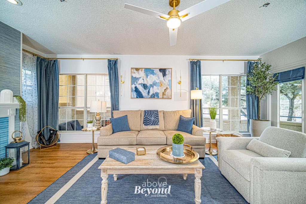a living room with a couch and a table at Elegant Condo Memorable Spring Lakeview on a beautiful Island in Lago Vista