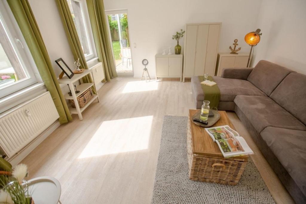a living room with a couch and a coffee table at Apartment No2 in Stralsund