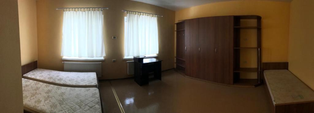 Postel nebo postele na pokoji v ubytování Guest House KARTA F M