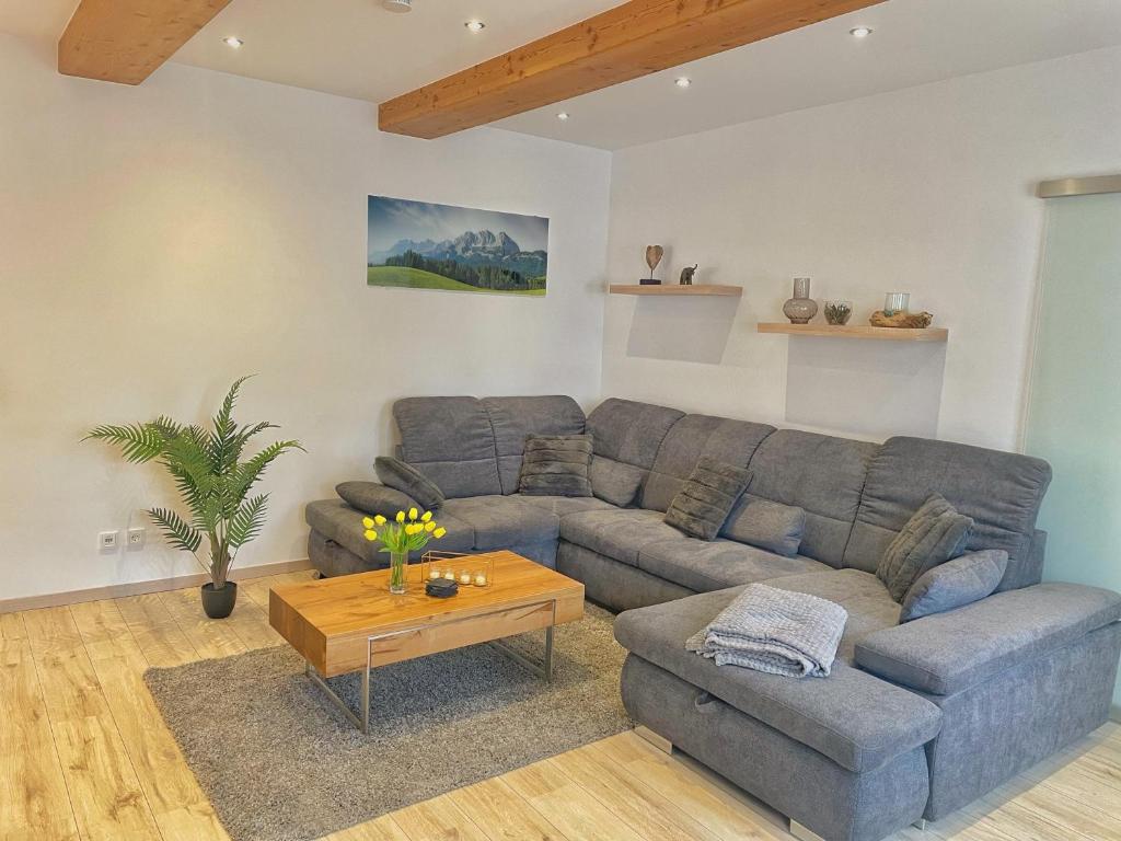 a living room with a couch and a table at Wohnung 3 Am Schlosspark in Bad Harzburg