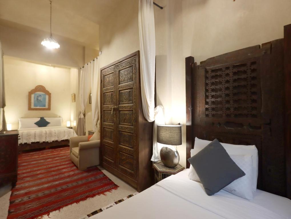 Postel nebo postele na pokoji v ubytování Riad Villa Elgada