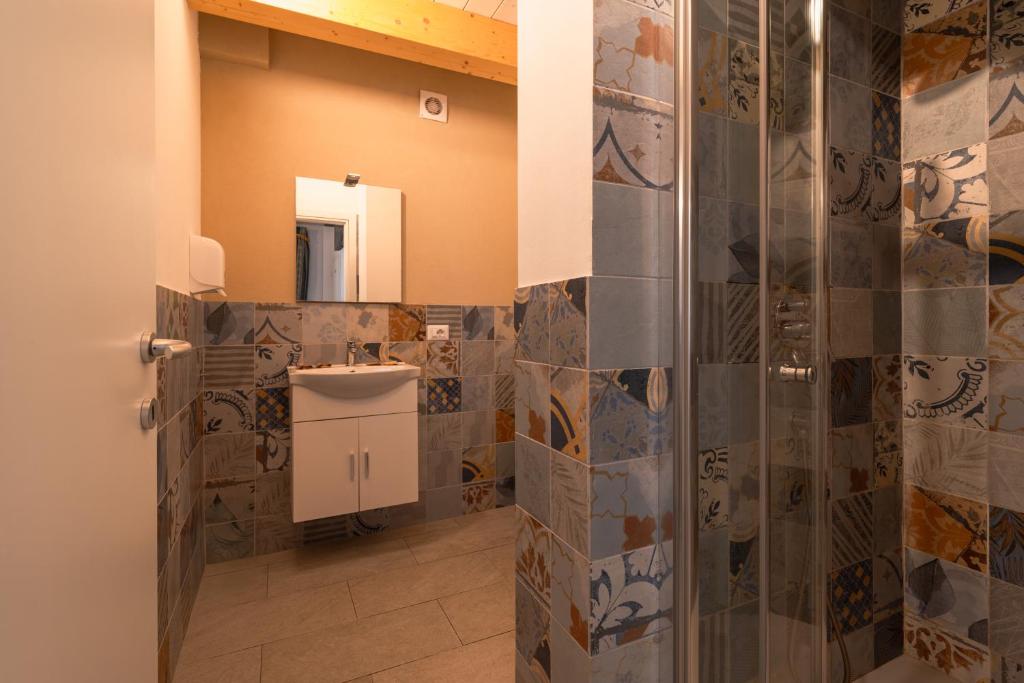 a bathroom with a shower and a sink at FloVe' Rooms Venice in Venice