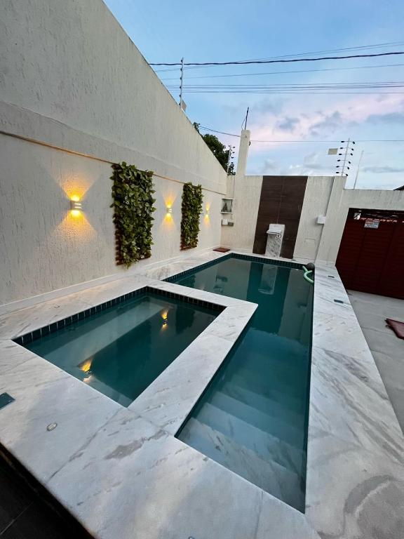 a swimming pool in the backyard of a house at Casa Gravata in Gravatá