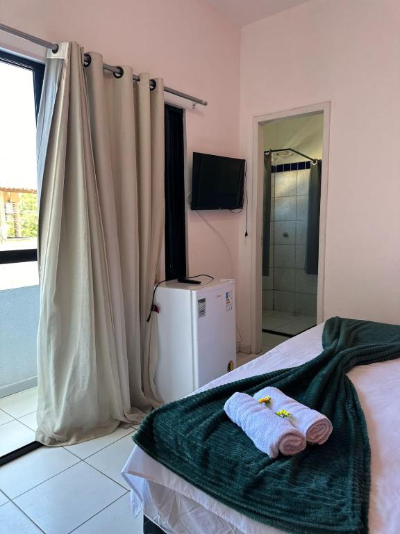 Postel nebo postele na pokoji v ubytování Pousada e Restaurante Kaizen