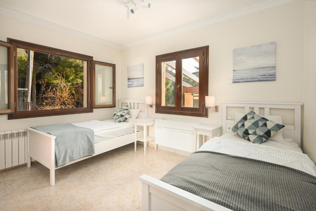 Postel nebo postele na pokoji v ubytování Villa Xapala - Cala Ratjada