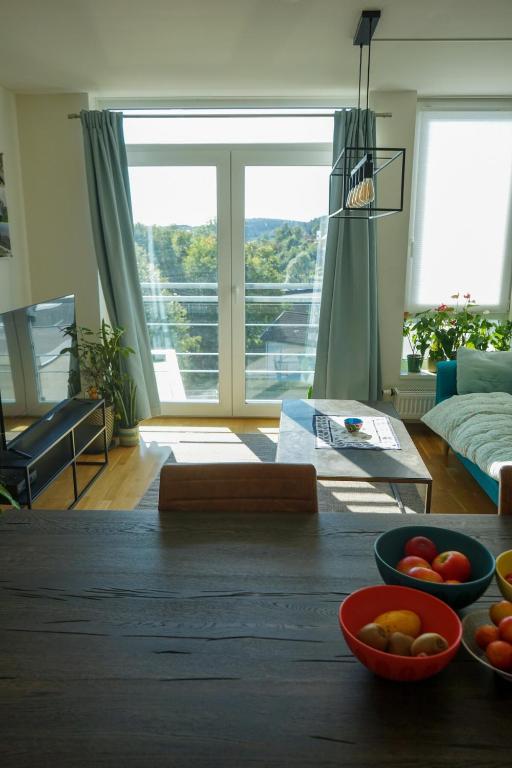a living room with a table with fruit on it at Solrik leilighet på Byåsen in Trondheim
