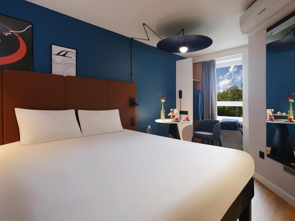 Postel nebo postele na pokoji v ubytování ibis Toulouse Pont Jumeaux