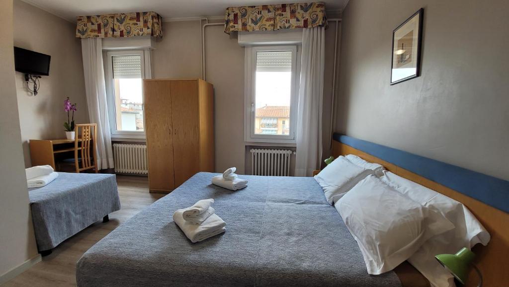 Postel nebo postele na pokoji v ubytování Hotel Montepiana