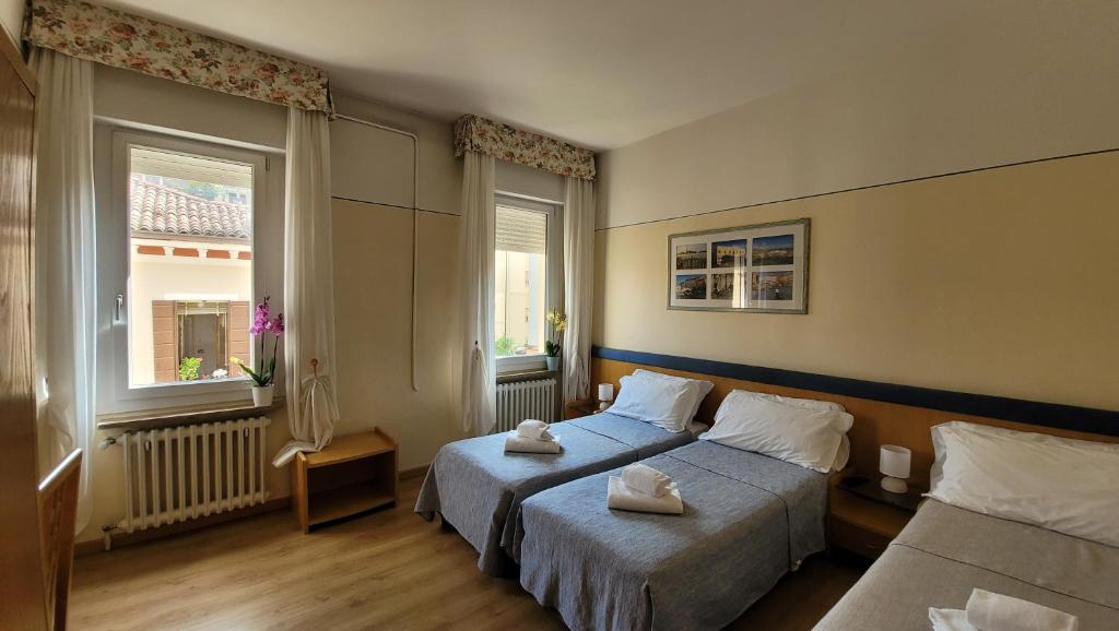 Postel nebo postele na pokoji v ubytování Hotel Montepiana