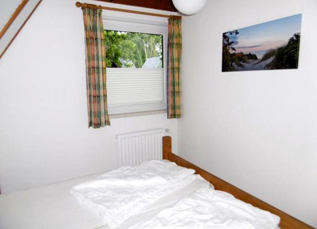 Postel nebo postele na pokoji v ubytování Ferienhaus Ida am Twistesee