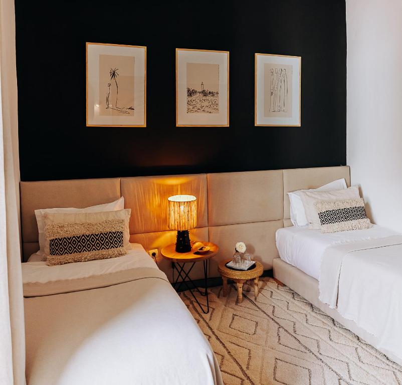 Postel nebo postele na pokoji v ubytování Riad Villa Wengé & Spa