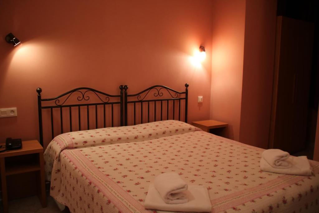 Postel nebo postele na pokoji v ubytování Hôtel Lutetia
