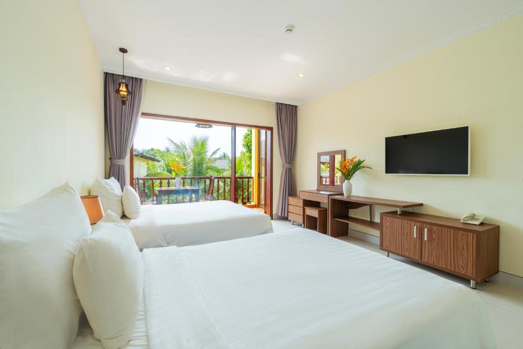 Giường trong phòng chung tại Herbal Resort & Spa