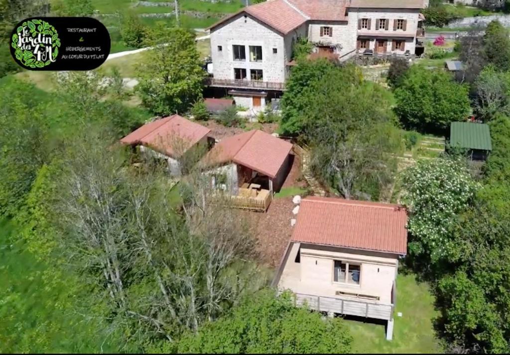 an aerial view of a house with a roof at Le Jardin des 4M in Saint-Régis-du-Coin