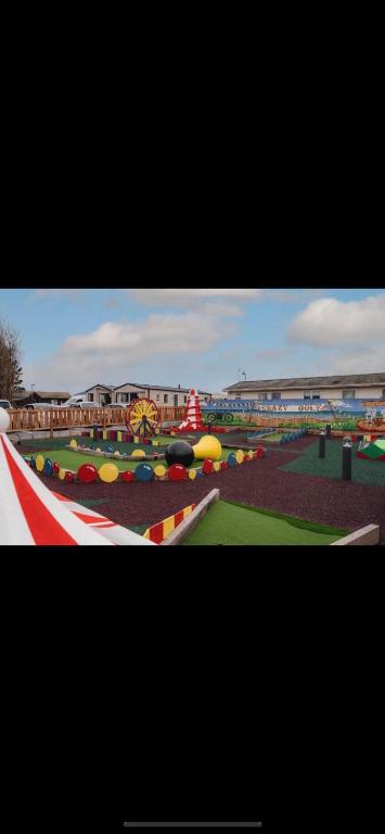 a view of a playground with many different colored balls at ellies caravan hire 8 berth in Kinmel Bay