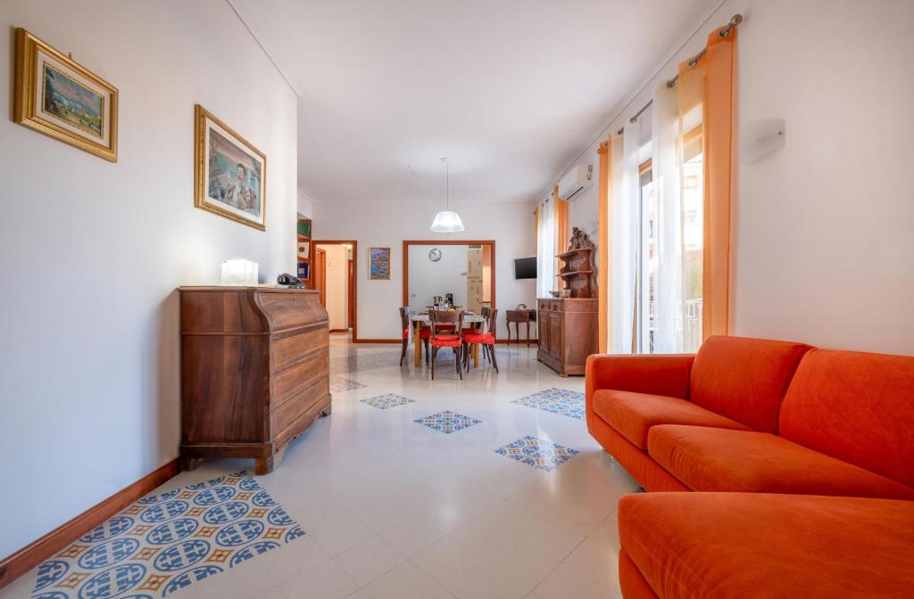 a living room with a couch and a table at Marziale Luxury Apartment in Sorrento