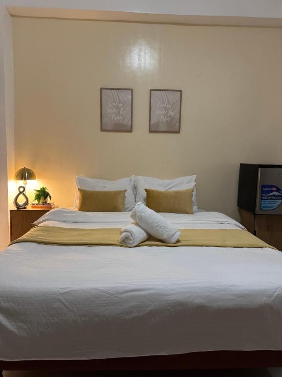 Postel nebo postele na pokoji v ubytování Bridgeview Residences