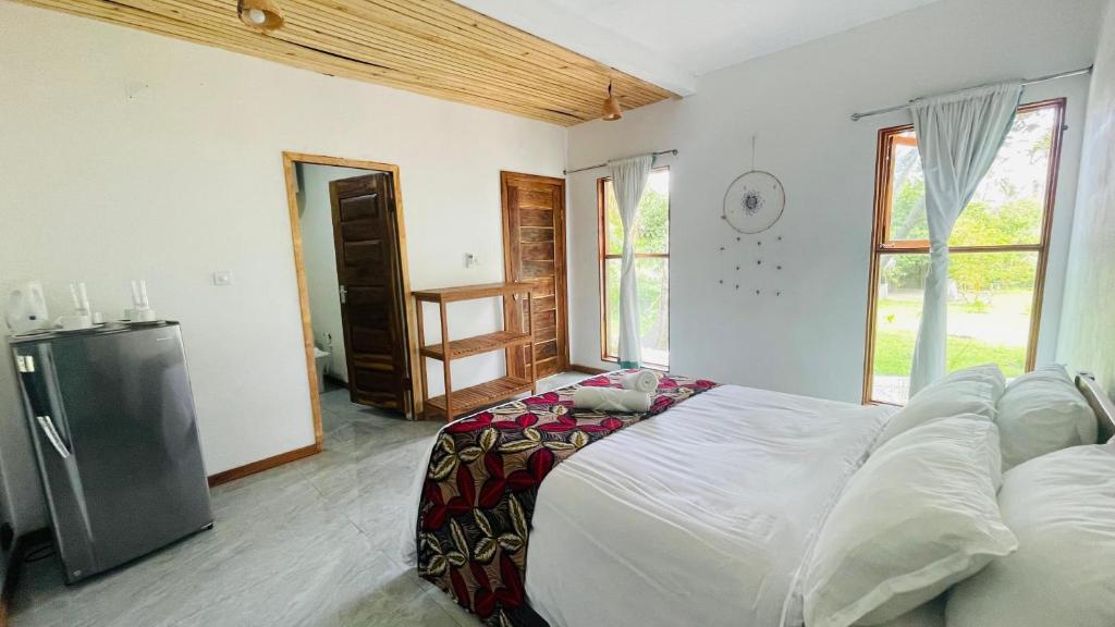 Postel nebo postele na pokoji v ubytování CosyBe Villas