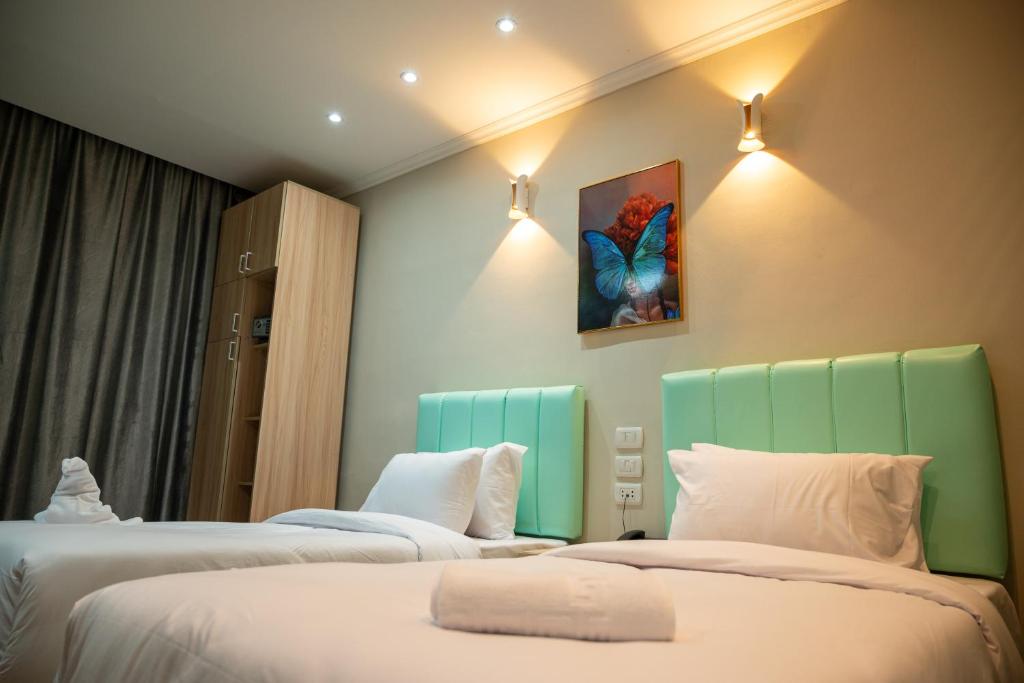 Postel nebo postele na pokoji v ubytování Soft Hotel