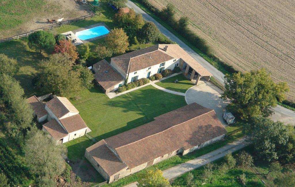 an overhead view of a house in a field at Le Vieux Logis de la Galocherie in Sainte-Florence