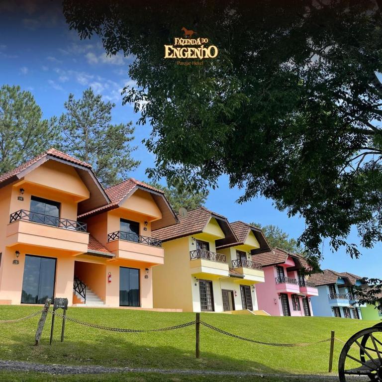 a building with a fence in front of it at Fazenda do Engenho Parque Hotel in Piratuba