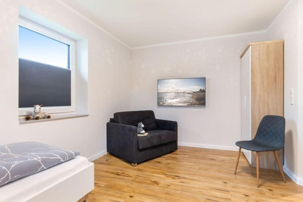 TV a/nebo společenská místnost v ubytování Ferienhof Marquardt Bungalow 4