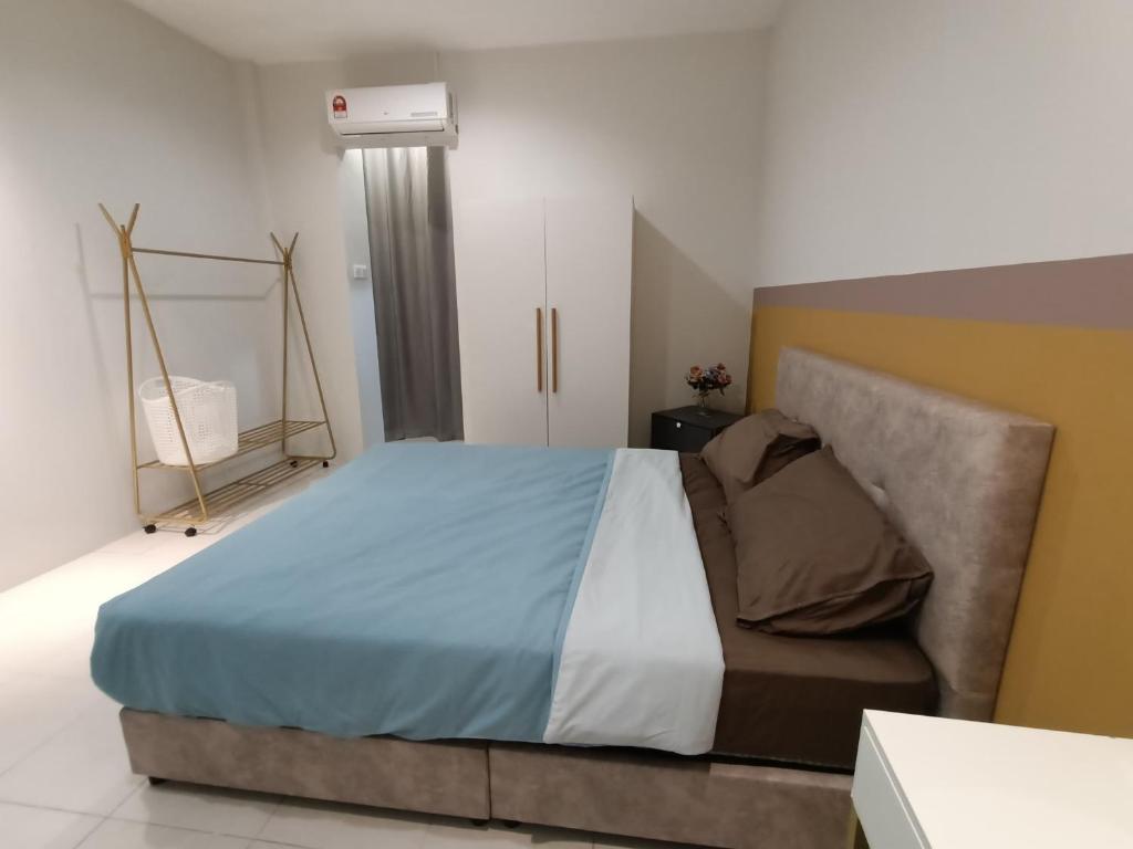 Ένα ή περισσότερα κρεβάτια σε δωμάτιο στο Empire Citystay at Moyan-4Queen