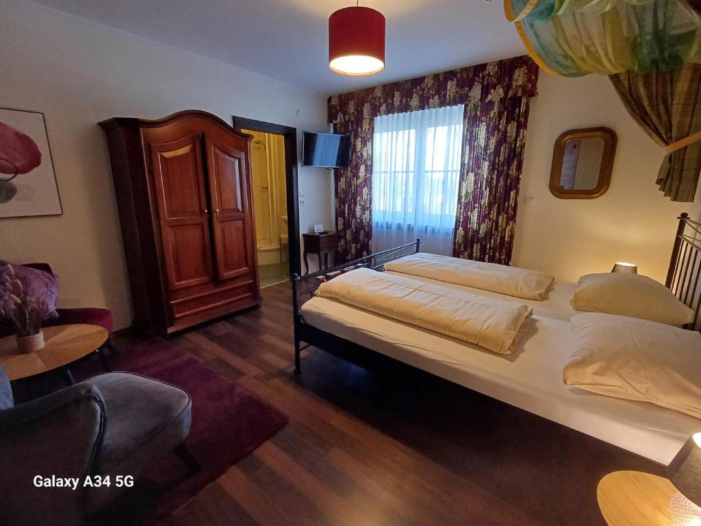 Posteľ alebo postele v izbe v ubytovaní Haus am Moos