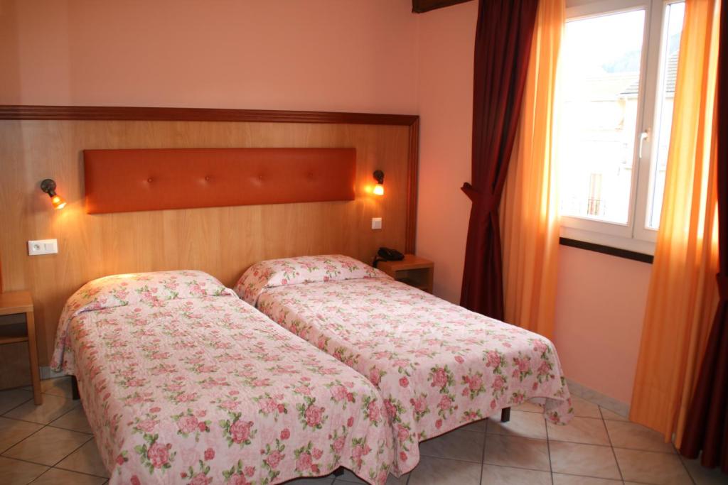 Postel nebo postele na pokoji v ubytování Hôtel Lutetia
