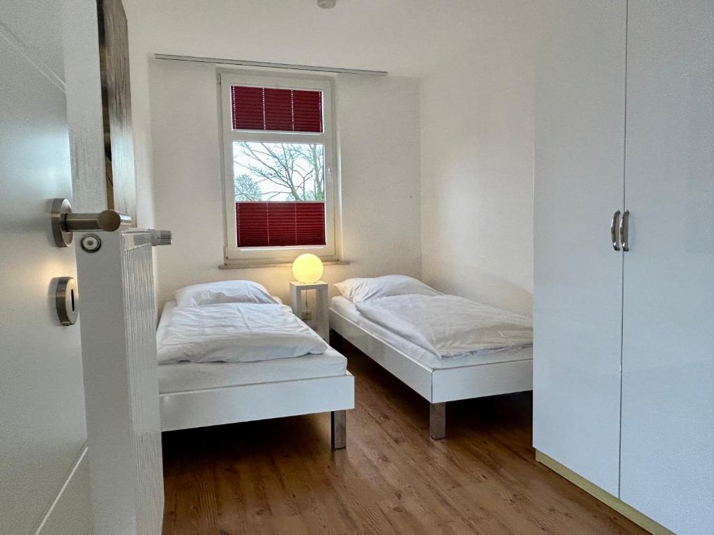Postel nebo postele na pokoji v ubytování Ferienwohnung Ost