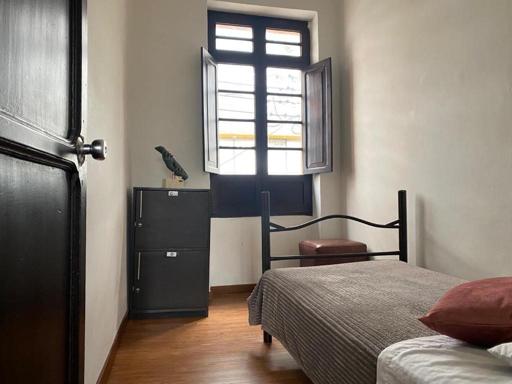 Postel nebo postele na pokoji v ubytování Destino Nómada Calle 11 n 1-38