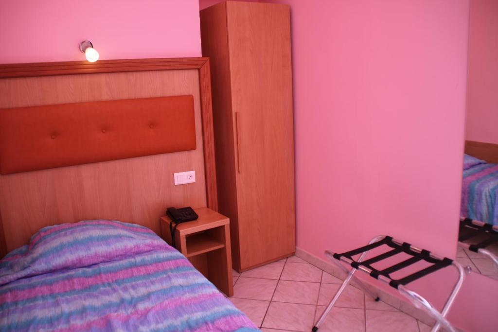 Postel nebo postele na pokoji v ubytování Hôtel Lutetia