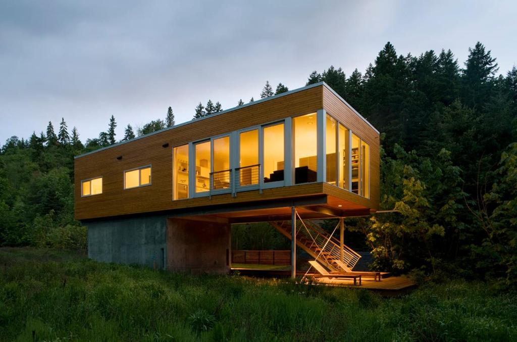 a house with glass windows on a hill at Neal Creek Retreat in Hood River