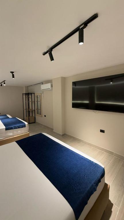 Postel nebo postele na pokoji v ubytování Hotel Suramericana