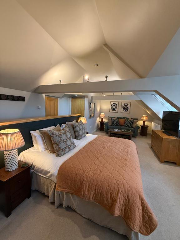 a bedroom with a large bed in a room at The Red Lion Inn Alnmouth in Alnmouth