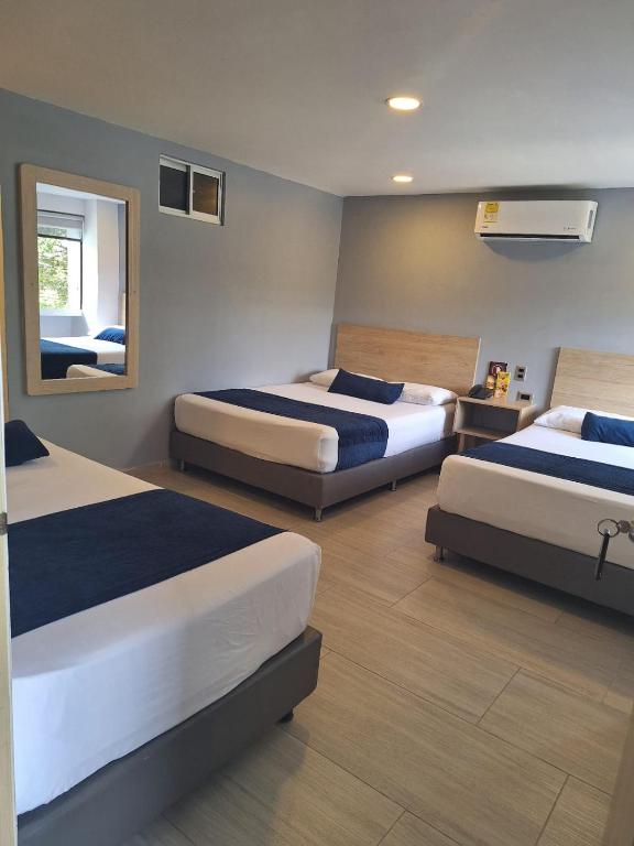 Postel nebo postele na pokoji v ubytování Hotel Suramericana