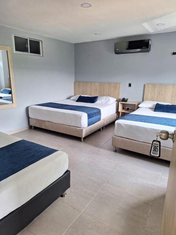 Postel nebo postele na pokoji v ubytování Hotel Suramericana