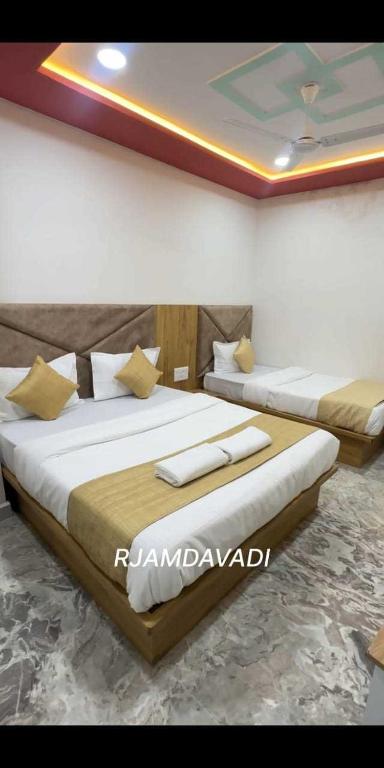 Postel nebo postele na pokoji v ubytování Hotel Sunrise Rooms