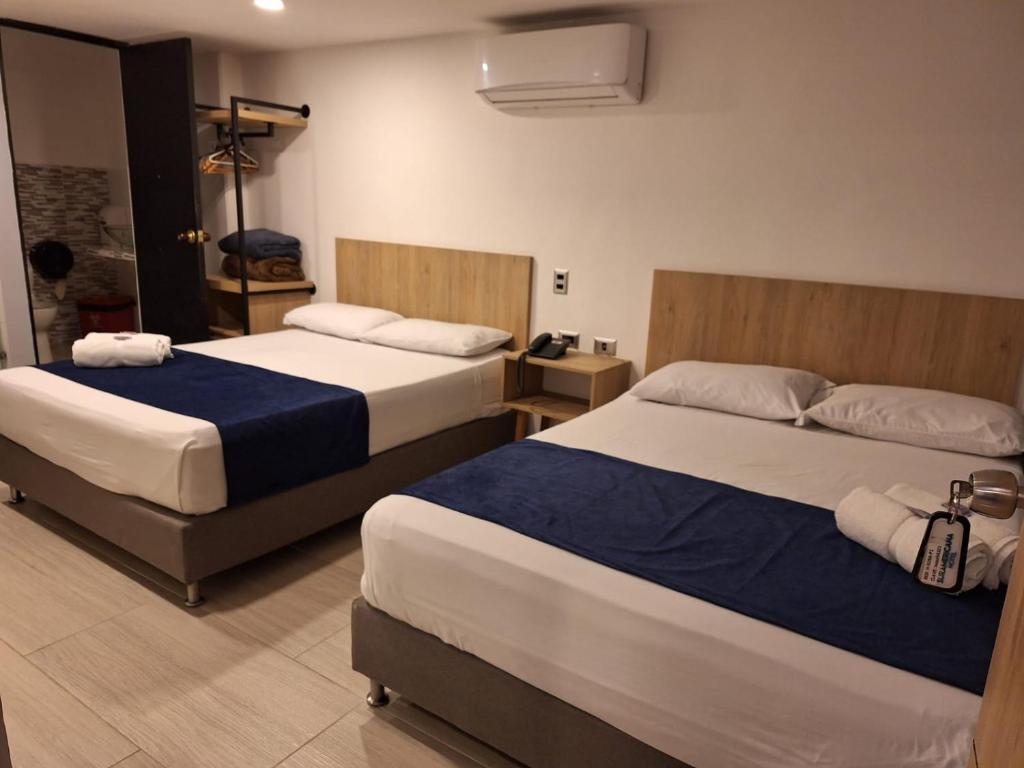 Postel nebo postele na pokoji v ubytování Hotel Suramericana