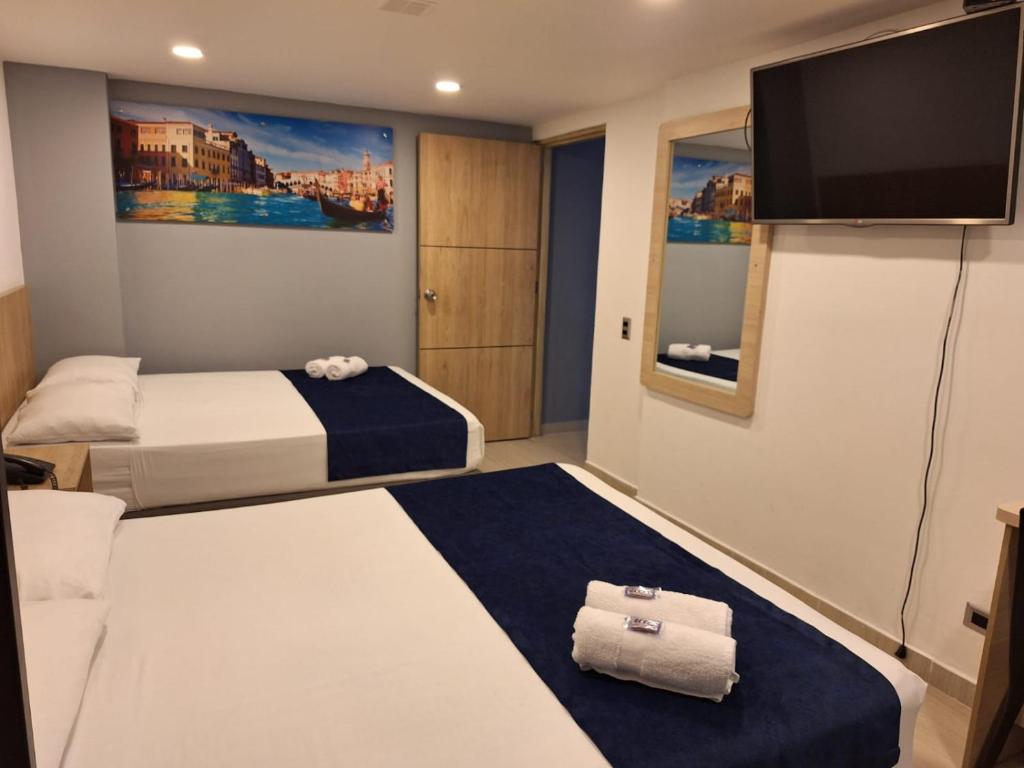 Postel nebo postele na pokoji v ubytování Hotel Suramericana