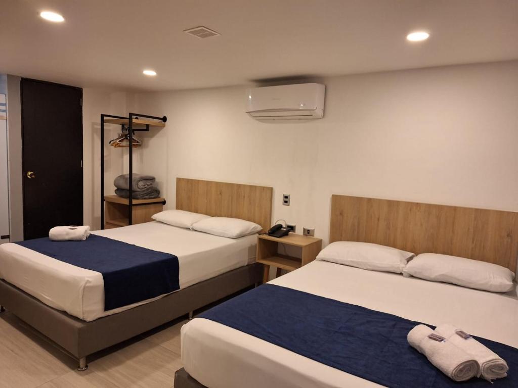 Postel nebo postele na pokoji v ubytování Hotel Suramericana