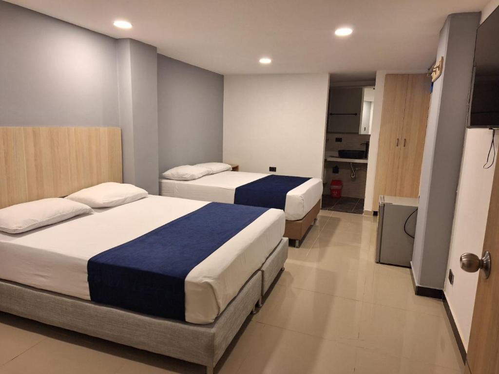 Postel nebo postele na pokoji v ubytování Hotel Suramericana