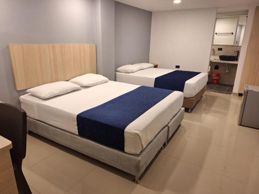 Postel nebo postele na pokoji v ubytování Hotel Suramericana