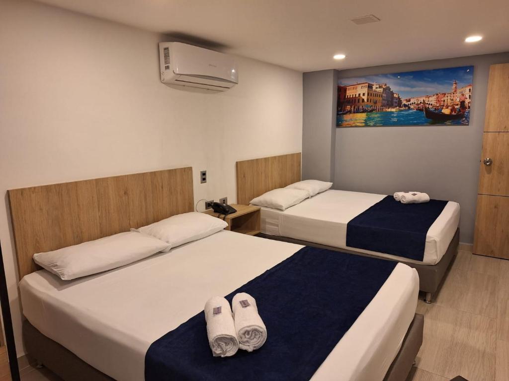 Postel nebo postele na pokoji v ubytování Hotel Suramericana